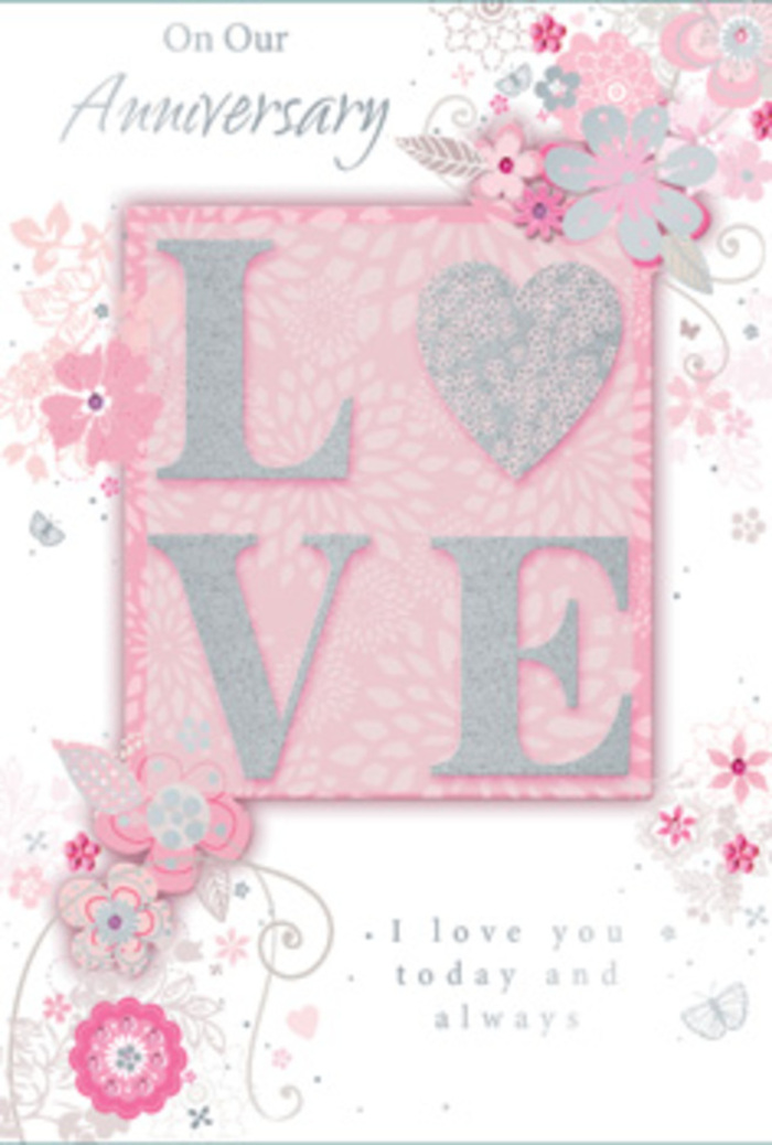 In this image, an anniversary card is depicted with a delicacy that mirrors a hand-finished floral design, the kind you might order for delivery around West Ham to mark a meaningful milestone. The focal point is the word "LOVE," presented in large, raised letters that feel almost sculpted from glitter. The surface of each letter is dusted with a frosted sparkle in shades of blush pink, creamy white, and understated silver, creating a shimmering effect that shifts softly as light plays across it. The raised texture suggests a gentle tactile experience-slightly rough yet refined, like the surface of fine decorative paper. Framing this central text is a blush-pink background that appears smooth and velvety, its colour modest and soothing rather than vivid, reminiscent of the gentle hues seen in spring flowers along paths near West Ham Station. From the edges of the word, fine, swirling illustrations of flowers and leaves extend outward, curving and looping in an organic, almost whimsical pattern. The blossoms are stylised, resembling dainty garden flowers with open petals and slender stems, rendered in soft pinks, lilacs, ivory, and pale grey. Subtle silver touches accentuate petal edges and leaf veins, adding a quiet sparkle that suggests celebration without excess. These swirling florals form a loose frame around "LOVE," much like how a florist might encircle a focal bloom in a bouquet. Inside, an elegantly scripted message speaks of ongoing affection and loyal partnership-phrases reflecting "On Our Anniversary" and "I love you today and always." The overall impression is that of a tender, thoughtfully designed keepsake, perfect for couples in West Ham who appreciate romance expressed through delicate details and gentle colour harmonies.